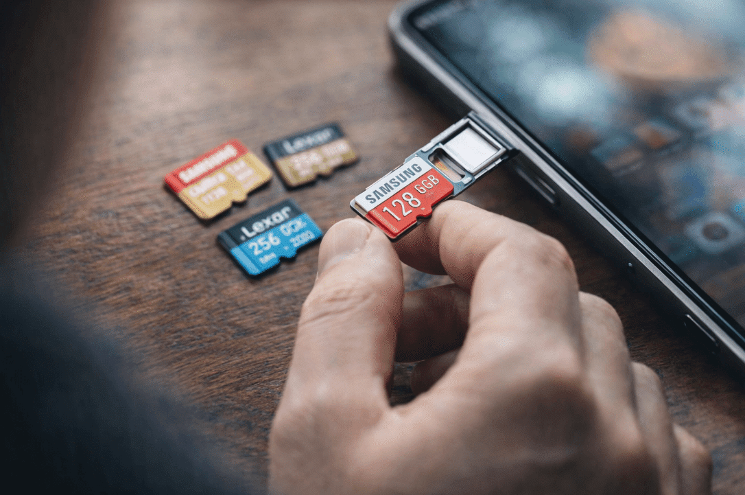 Person holding a microSD card for Android storage solution
