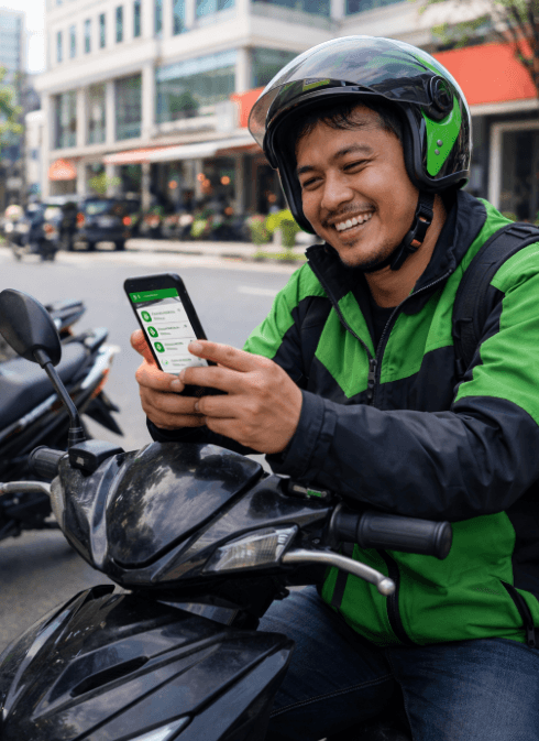 Ojek online driver checking cell phone for orders